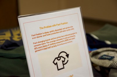 poster at event with information on fast fashion