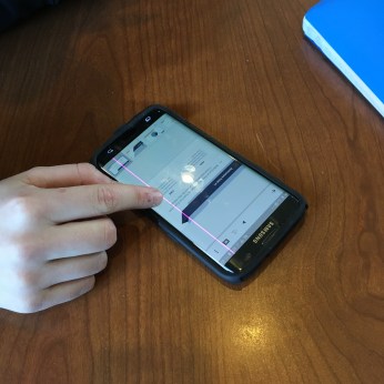 Maria Maguire looks at her notes on her phone